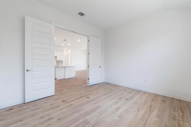 Unfurnished room featuring light wood finished floors, recessed lighting, baseboards, and a sink | Image 23