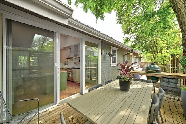 11x8 sliding glass doors open to the shaded back deck | Image 13