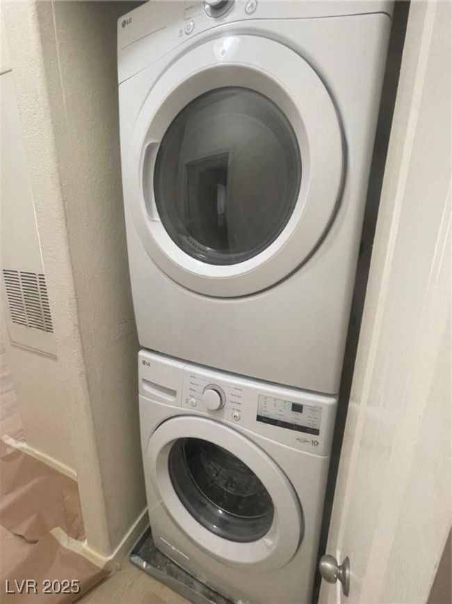 Laundry room with estacked washer and dryer | Image 24