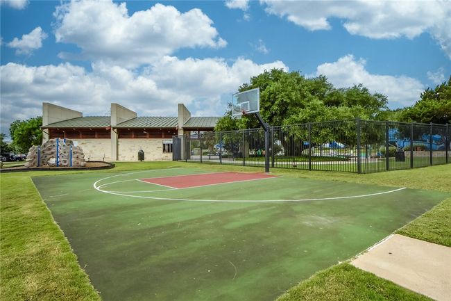 There are multiple sports courts including basketball, tennis, and volleyball courts. | Image 32