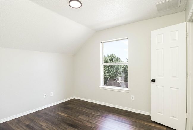 Bonus room with vaulted ceiling, dark wood-type flooring, and baseboards | Image 13