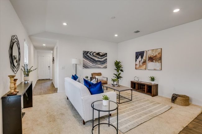 Living area featuring recessed lighting, baseboards, visible vents, and light wood finished floors | Image 4