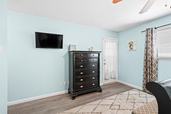 Access to the relaxing back patio & pool from Primary bedroom | Image 13