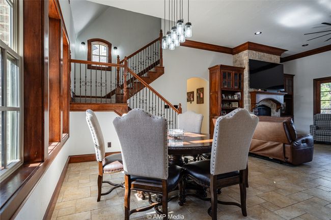 Dining room with an inviting chandelier and ornamental molding | Image 16