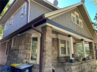 Craftsman style home featuring stone porch | Image 2