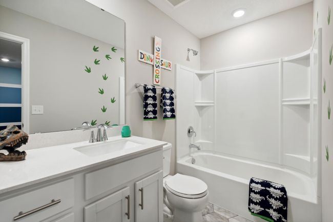 The home's secondary bath features a vanity with extra space to help keep everyone moving during those busy mornings. *Pictures are of model home; Colors and options may vary | Image 15