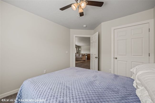 Carpeted bedroom with baseboards and ceiling fan | Image 36