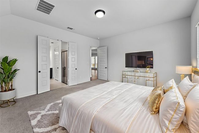 Carpeted bedroom with baseboards | Image 13