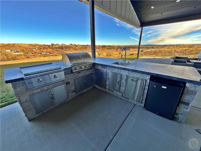 Grilling with a view.Flat-top + grill have covers. Outdoor fridge stays. | Image 18