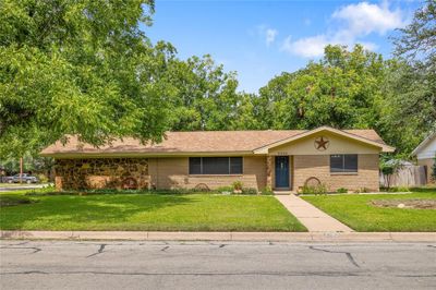 Ranch-style home featuring a front yard | Image 1