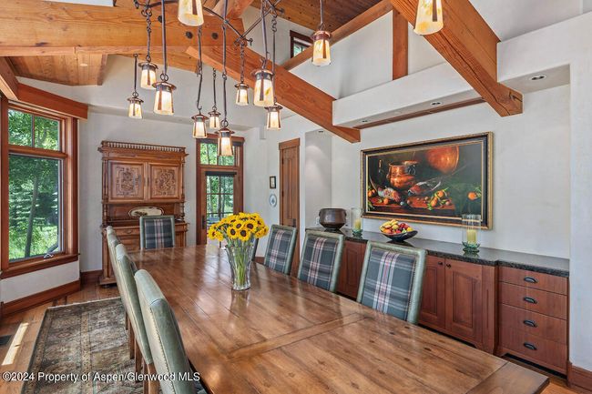 Sidebar cabinet in dining room has a stone top, the entirety of which can be heated. The painting was commissioned for this room and is included. | Image 23