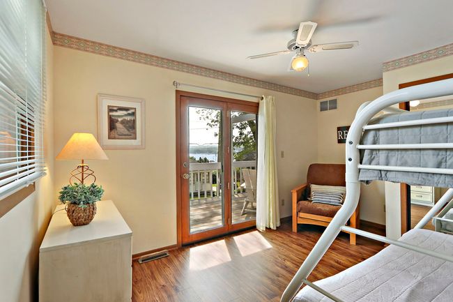 Second floor bedroom with access to lakefront deck | Image 20