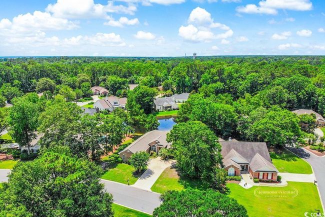 Aerial perspective of suburban area with a forest | Image 35