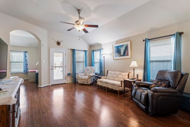 Living room is spacious with high ceiling & a great view of back patio. | Image 17