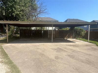 View of parking / parking lot featuring a carport | Image 2