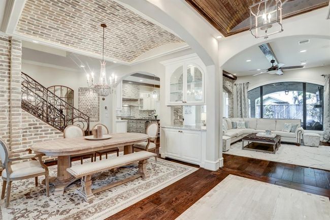 Formal dining adorned with brick detail. | Image 4