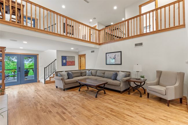 Living Room Feature a Vaulted Ceiling and Double Doors to the Front Deck. | Image 9