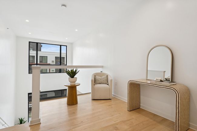 Vaulted ceilings and a flexible layout make this upper-level loft a standout space, perfect for unwinding or entertaining. | Image 26
