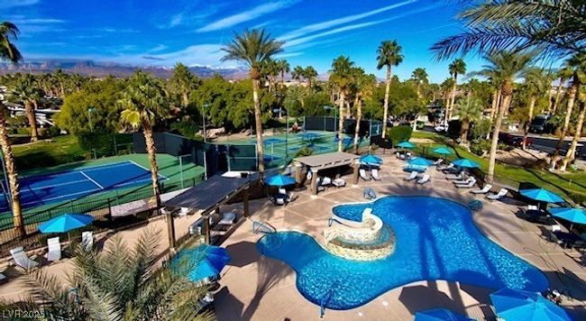 Community pool with a patio area and fence | Image 9