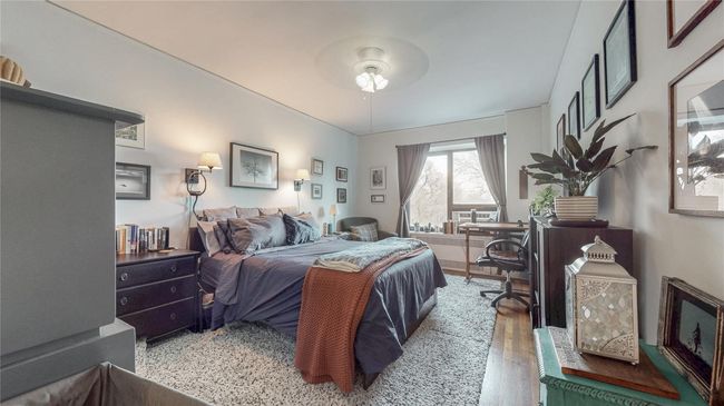 Bedroom featuring ceiling fan and wood finished floors | Image 14