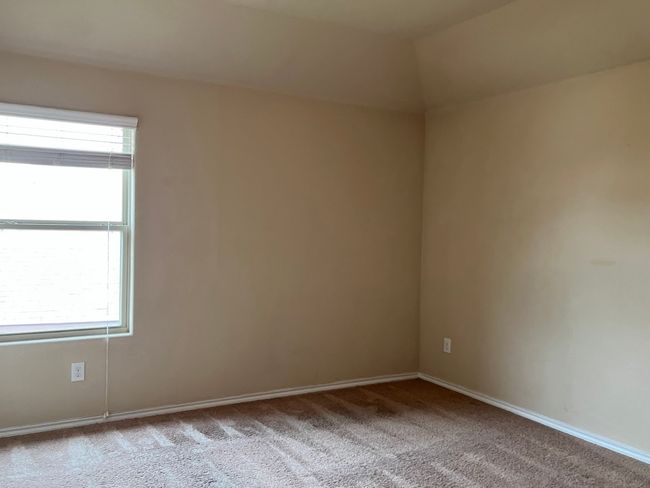 Carpeted spare room with baseboards | Image 26