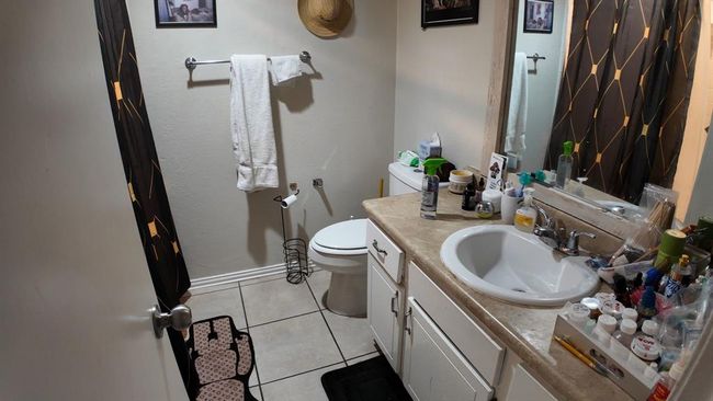Bathroom featuring vanity and tile patterned floors | Image 11