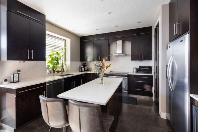 67 Tusslewood View Nw, Home with 4 bedrooms, 3 bathrooms and 4 parking in Calgary AB | Image 6