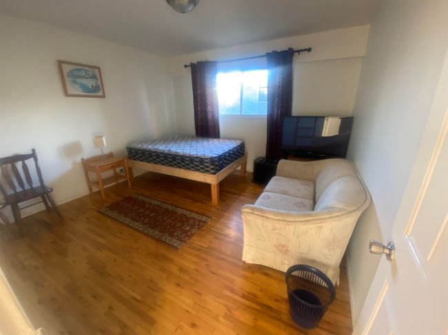 Bedroom featuring wood finished floors | Image 7