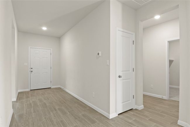 Hall featuring wood tiled floors and recessed lighting | Image 6