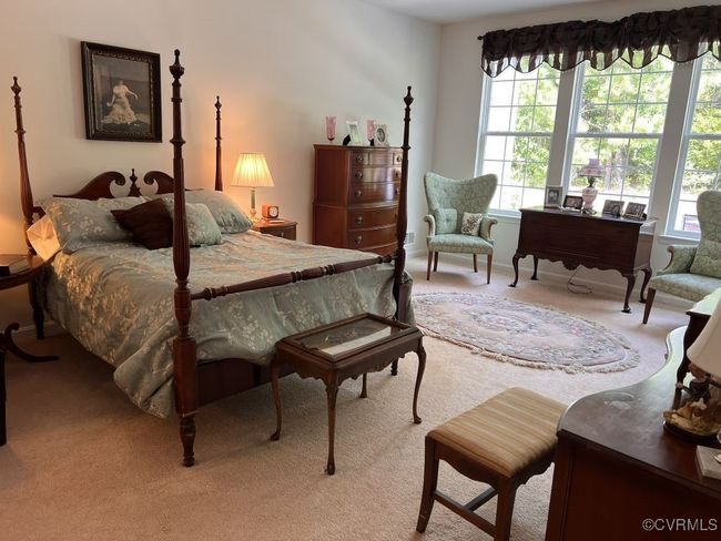Bedroom featuring light carpet | Image 30