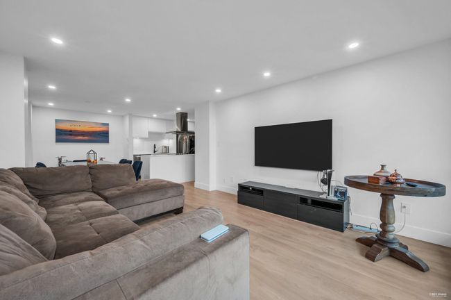 Living room featuring light wood-style floors, recessed lighting, and baseboards | Image 21