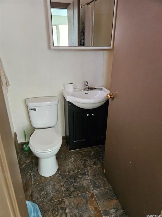 Bathroom featuring vanity, stone finish flooring, and curtained shower | Image 11
