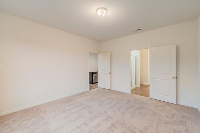 Unfurnished bedroom with carpet floors and baseboards | Image 9