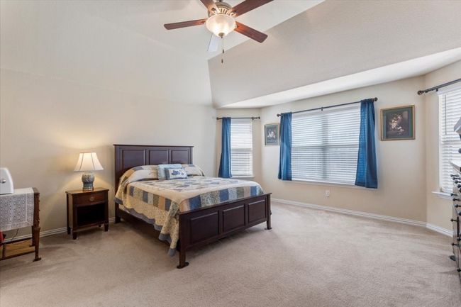 Primary bedroom is super spacious with bay window wall & tall ceiling & fan/light. | Image 19