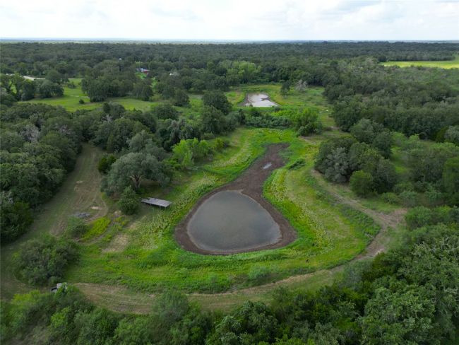 View of property location featuring a heavily wooded​​‌​​​​‌​​‌‌​‌‌​​​‌‌​​‌‌​‌​​​​​‌ area | Image 8