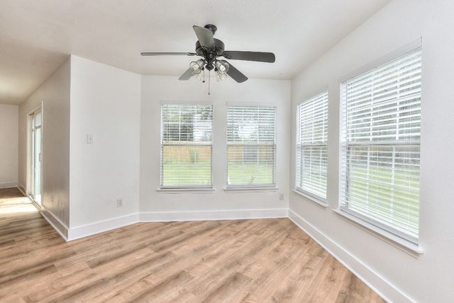 Notice all the windows across the back of the home that floods the home with natural light! | Image 12