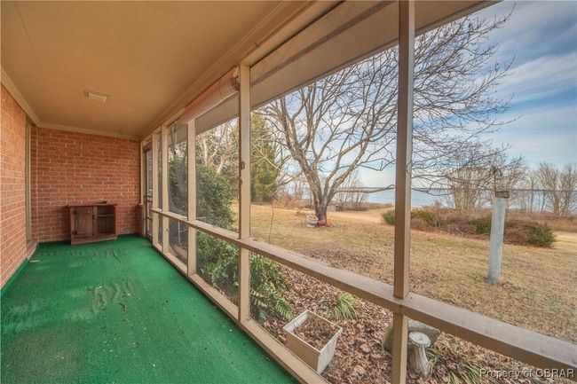 View of unfurnished sunroom | Image 34