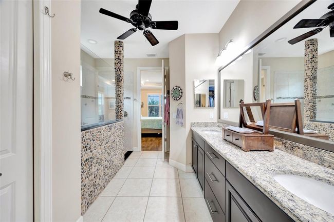 Primary bath with dual sinks and walk in closet | Image 19