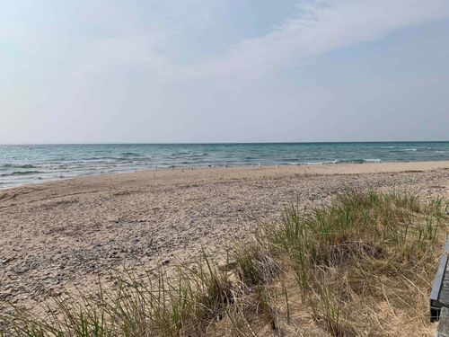410 S Golden Beach Dr, Kewadin, MI, 49648-9221 | Card Image