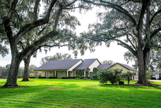 Surounded by beautiful live oaks gives privacy and the "Old Florida" feel. | Image 5