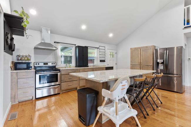 Extra large kitchen island in this modern kitchen. | Image 18