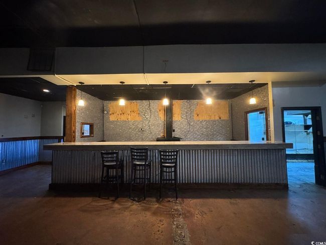 Indoor dry bar with concrete floors | Image 6