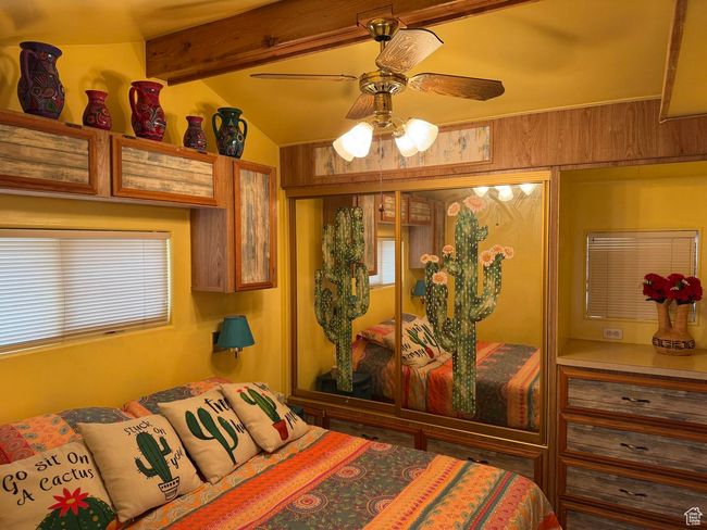 Bedroom featuring multiple windows and a ceiling fan | Image 13