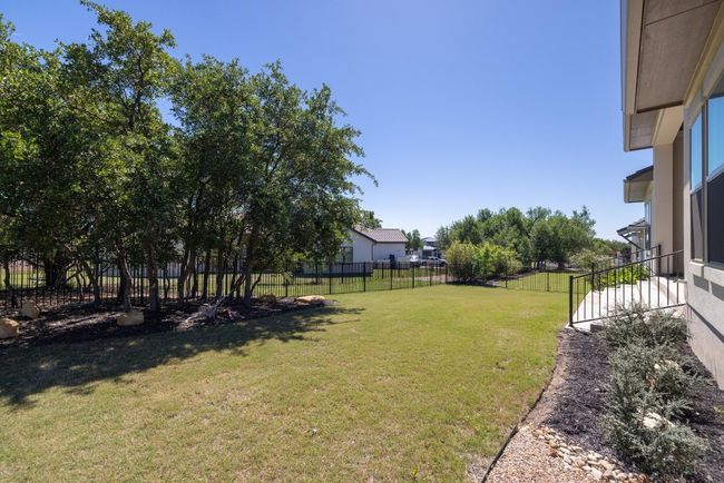 Nice backyard with trees & iron fencing | Image 10