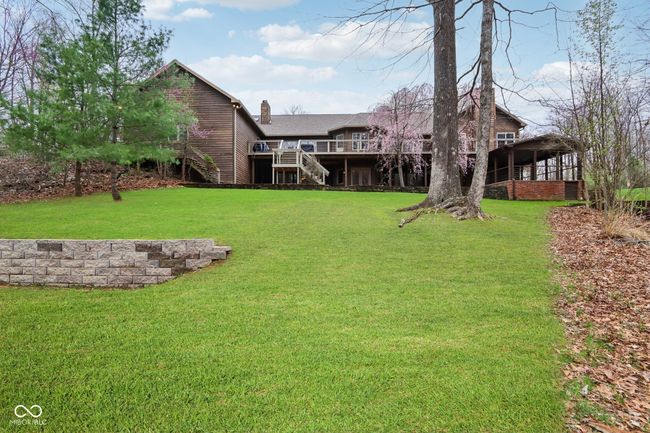 view of yard with stairs and a wooden deck | Image 51
