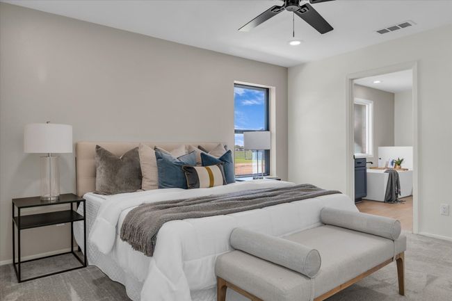 Bedroom featuring visible vents, baseboards, a ceiling fan, recessed lighting, and light carpet | Image 38