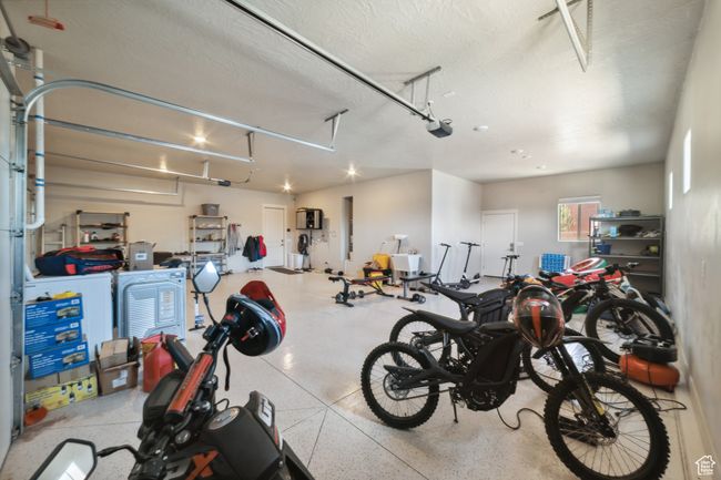 Garage with a garage door opener | Image 37