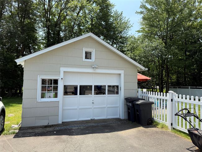 Detached garage with large driveway wit parking for many | Image 24