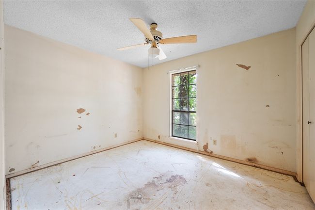 Unfurnished room with a textured ceiling and a ceiling fan | Image 9
