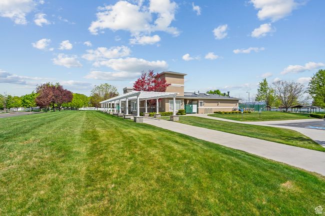 Exterior Clubhouse featuring a pergola and a front yard | Image 54